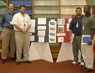 Mentors Bill Hargrove (CPED) and Forrest Hoffman (ESD), at left, with students Randy Debasa and Drew Obeng, at right.